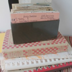 Aunt Ann recipe box atop cookbooks
