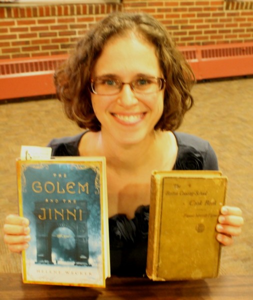 Wecker holding both books