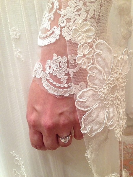 Kara wedding photo of ring and dress sleeve