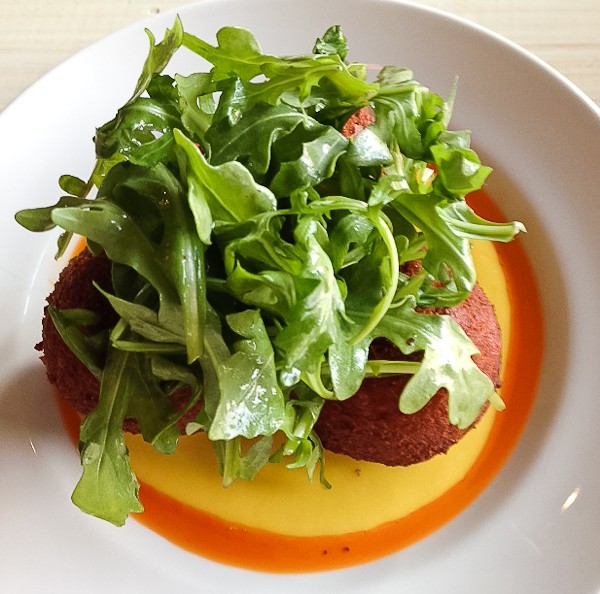 Trace arancini with arugula