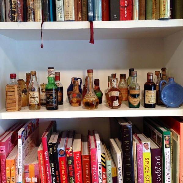 Omnivore book shelf with liquor bottles