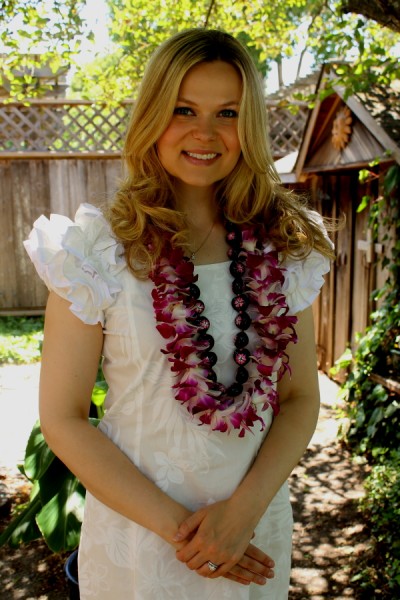 Tonga Kara in white dress