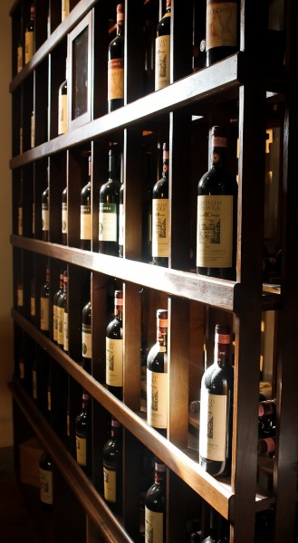 Tuscany wine bottles on shelf