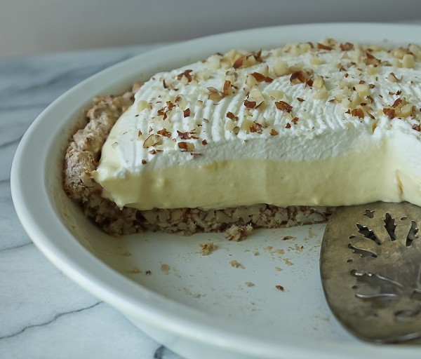 Almond pie sliced in pan