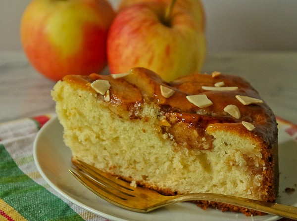 Glazed apple cake slice with apples