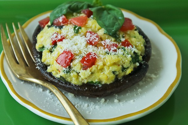 Portobello egg full with fork on plate