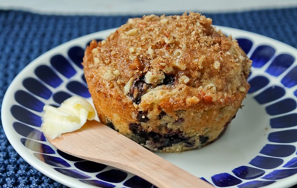 Blueberry muffin on blue plate