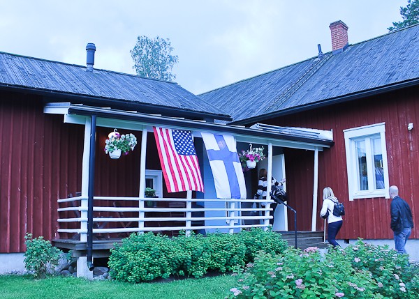 Farmhouse entry with flags