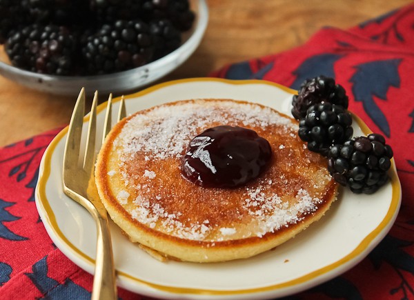 Scottish pancake with bowl of blackberries_